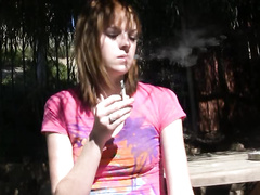 Kate smoke a cigarette and spreads her legs