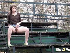 Hairy girl lifts her skirt and pisses outdoors