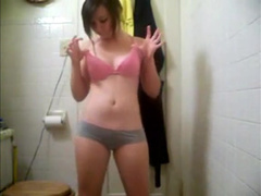 gorgeous shy teen strips and shows tits
