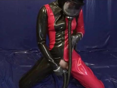Young Latex Pissing Girl with Rubber Gasmask and Sniffing Pussy Dildo