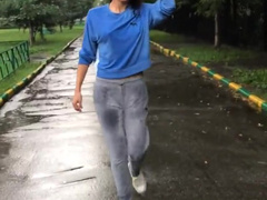 Adorable Asian in the rain showing her tits