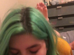 Green Hair Girl Gives Blowjob With Feet Showing