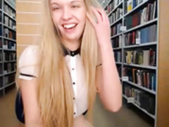 Blonde Slut in White Blouse in a Library