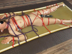 Bondage with ropes to the frame in latex bed with vibro
