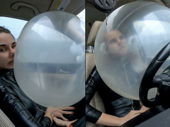 Nastya is stuck in the airbag and wants to rub her face and body on it