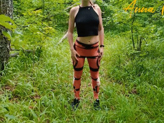 On a walk in the park, a girl in leggings masturbates her pussy