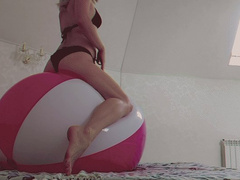 Alla hotly rides on a big beach ball and gets real pleasure from the ride!!!