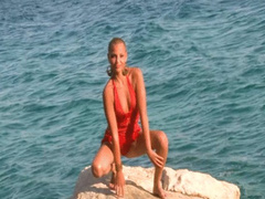 867 Emili Hot short haired model make striptease in ocean