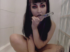 goth slut fucks herself and pees at the same time