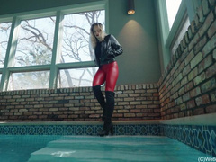 Camille in the Pool wearing a Red and Black Leather Outfit
