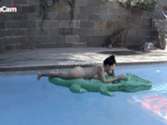 Margo and BF sunbathe naked in the pool