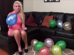 Watch this sexy babe sit to pop her balloons!