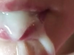 Close up cum shot into a whore mouth