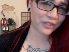 Spitting chubby redhead with tattoo and glasses