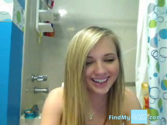 Blonde teen gets naked in the bath