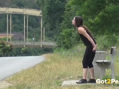 Piss Desperation - Gorgeous babe pees on the ground in public while out jogging