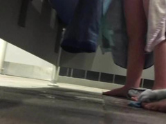 girl changing into her lycra in swimming pool changing room