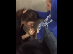 Cute young brunette gets caught giving head in a public bathroom