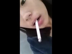 Kinky asian girl with big pussy lips smokes