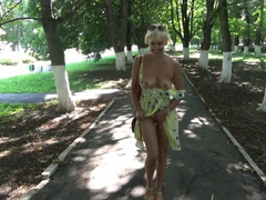 Sexy blonde flashing and hot masturbating in a public park.