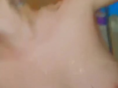 Cassie K. Enjoys a Golden Tittie Shower